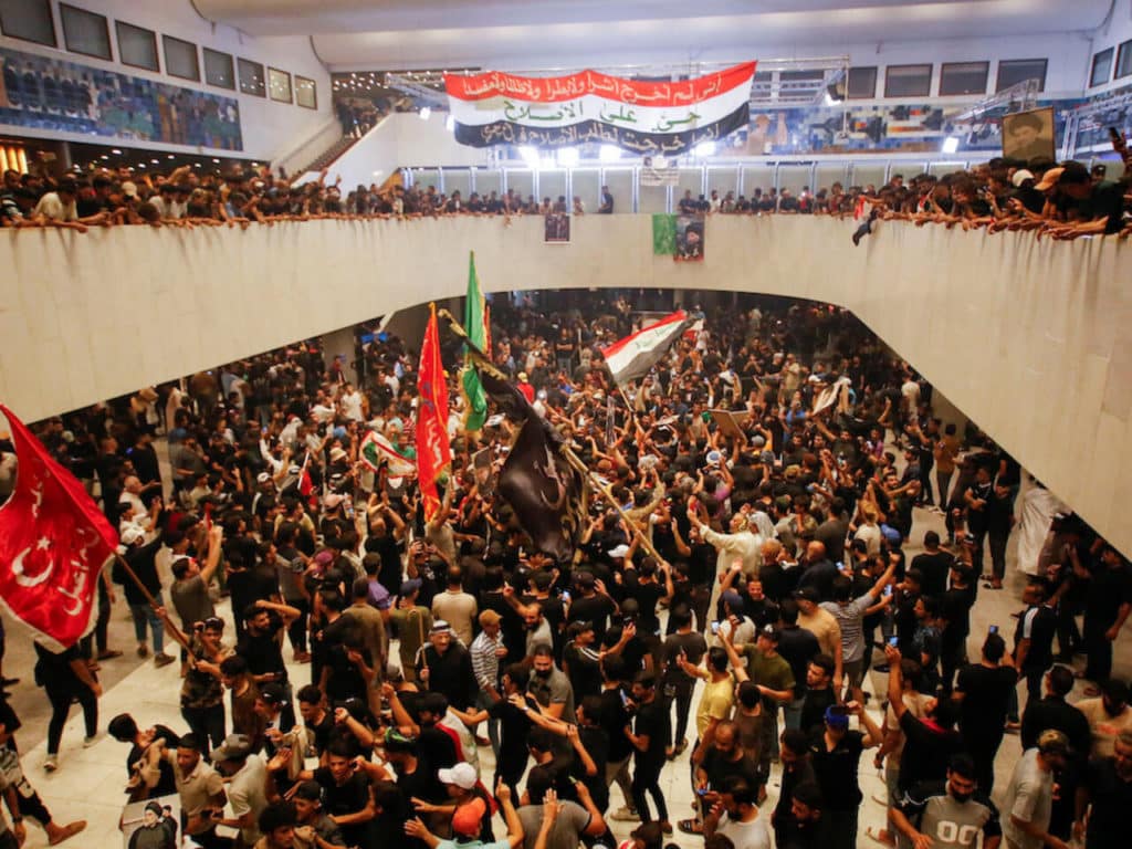 Supporters of Iraqi cleric Moqtada Sadr gather during a sit-in at the parliament building in Baghdad on July 31, 2022. © Saba Kareem, Reuters